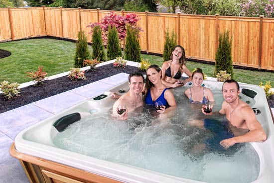 man in an Otter Arctic Spas hot tub